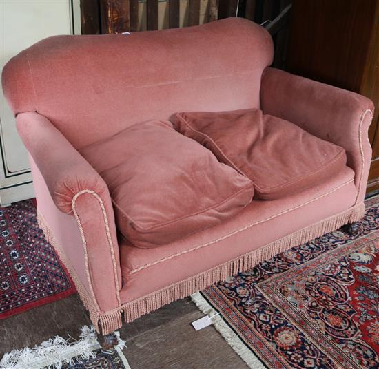 Pink settee, on claw and ball feet, with cushions